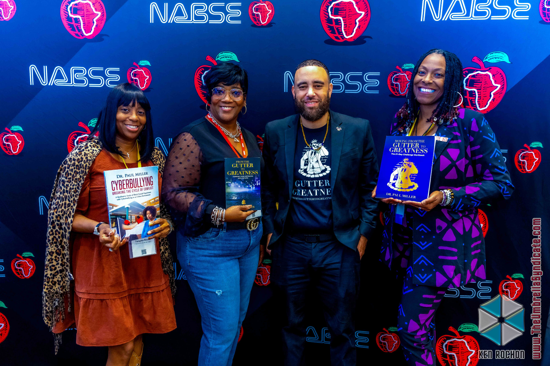 Dr. Miller with readers holding his books at NABSE